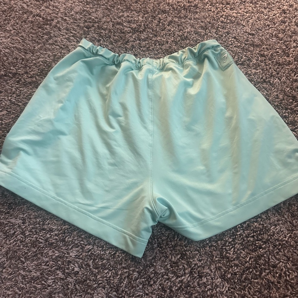 Gymshark shorts mint green with pockets and buttons!